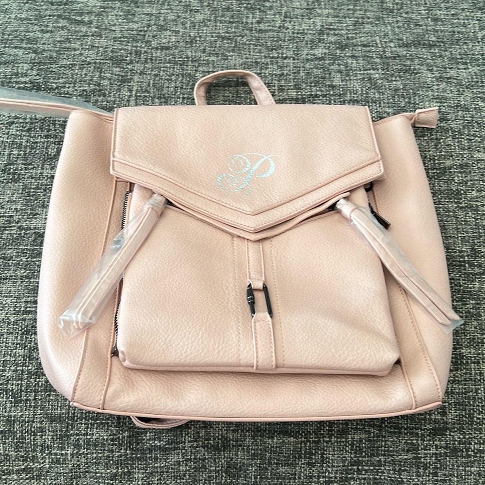 Plunder Pink backpack with zip off crossbody and strap